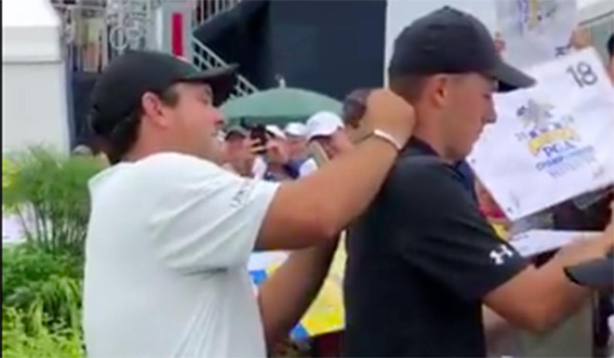 Watch Patrick Reed sign Jordan Spieth's neck at an autograph session at the PGA Championship