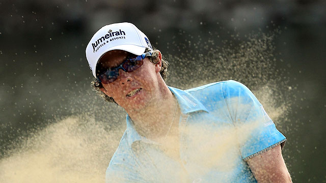 McIlroy leads in Dubai; Woods four back after 66