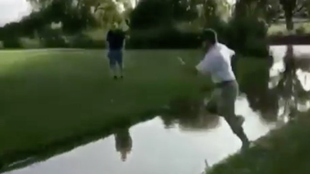 Golfer tries jumping over creek, fails miserably
