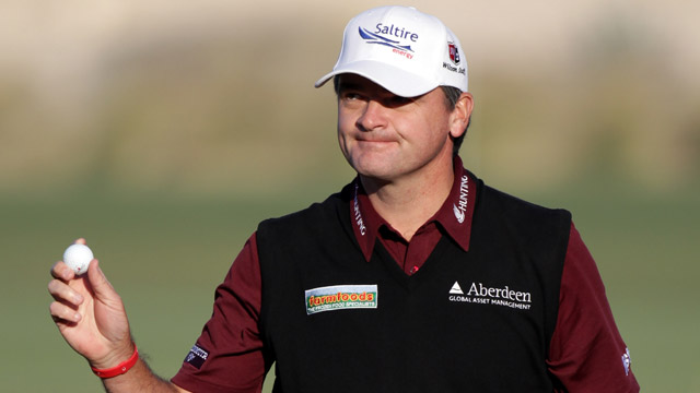 Lawrie takes lead in Qatar despite penalty for dropping ball on marker