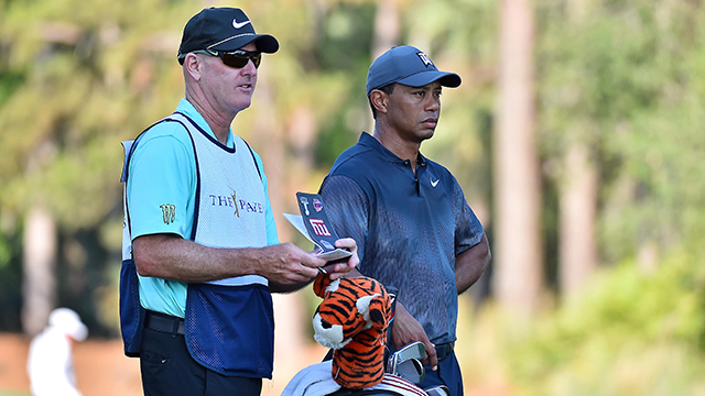 This man spent a boatload of money to be Tiger Woods’ caddy 
